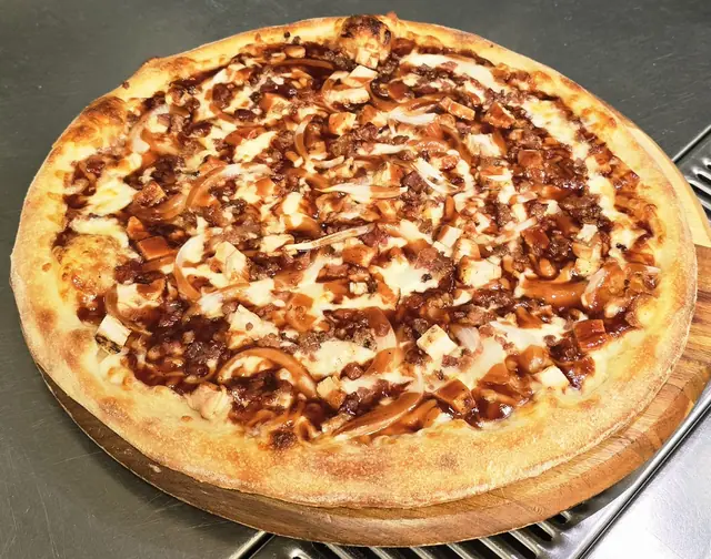 BBQ chicken pizza drizzled with barbecue sauce
