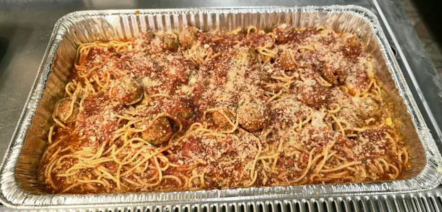 Full catering tray of spaghetti and meatballs